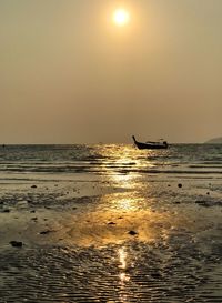 Scenic view of sea against sky at sunset