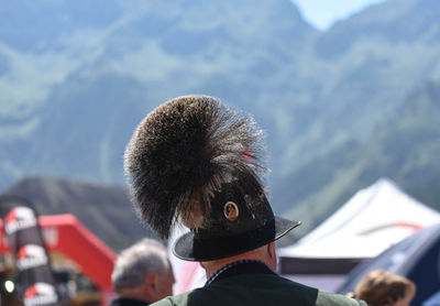 Rear view of people against sky