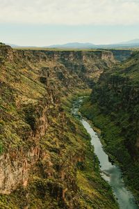 High angle view of river amidst landscape against sky