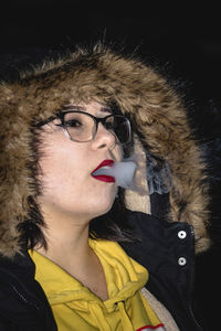 Portrait of young woman in snow