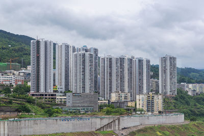 Modern buildings in city against sky