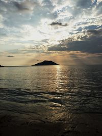 Scenic view of sea against cloudy sky