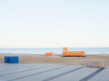 Lifeguard hut on beach against clear sky