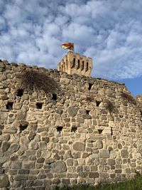 Low angle view of old ruins against sky