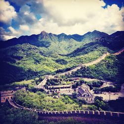 Scenic view of mountains against cloudy sky