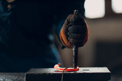 Close-up of man welding metal