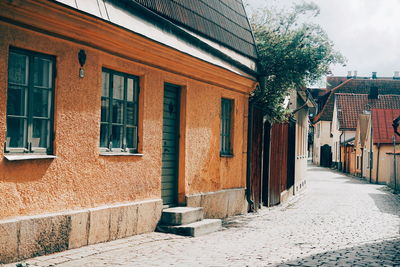 Houses by street in city