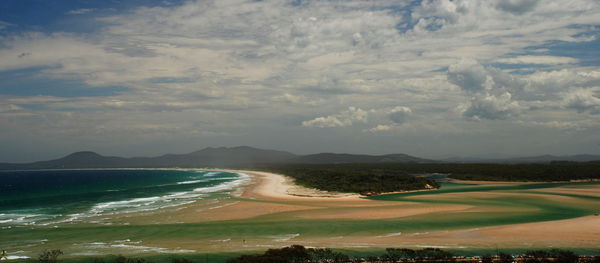 Scenic view of sea against cloudy sky