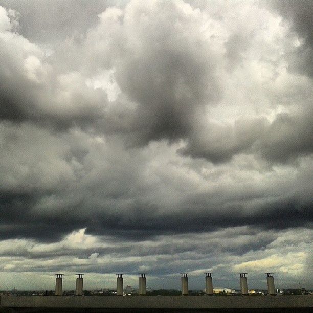 sky, cloud - sky, cloudy, architecture, built structure, building exterior, weather, overcast, cloud, storm cloud, low angle view, cloudscape, city, nature, day, outdoors, smoke stack, factory, no people, tower