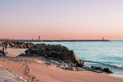 Scenic view of sea against clear sky during sunset