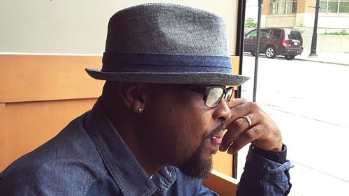 Close-up of thoughtful man sitting by window