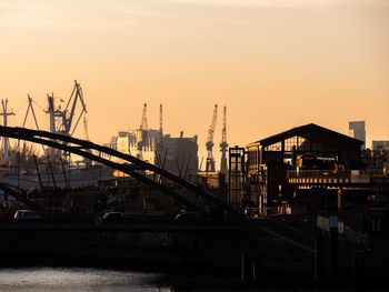 View of commercial dock against sky during sunset