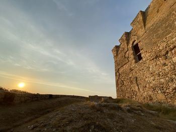 Low angle view of castle against sky during sunset