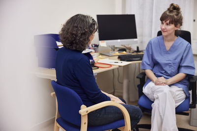 Patient and doctor in doctor's office