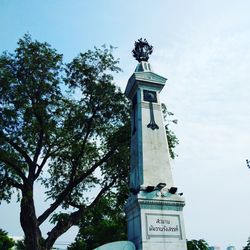 Low angle view of statue against sky