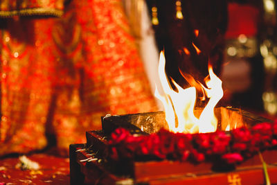 Close-up of lit candles in temple