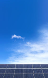 Solar panels against blue sky