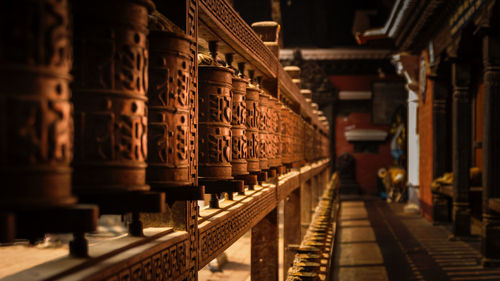 Row of wooden objects in temple