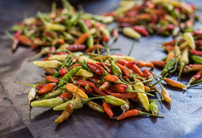 Close-up of chili peppers on table