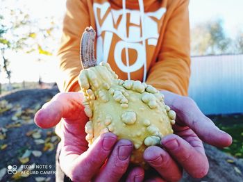 Midsection of person holding ice cream