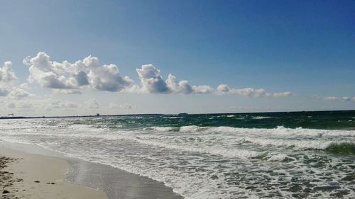 Scenic view of beach against sky