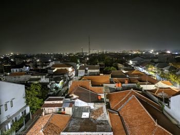 High angle view of townscape against sky at night