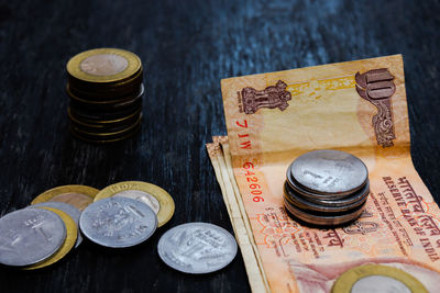 High angle view of coins on table