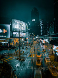 Cars on city street at night