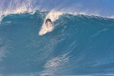 Person surfing in sea