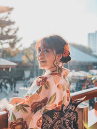 Young woman looking at city