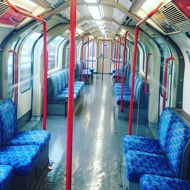 indoors, window, absence, empty, built structure, chair, architecture, day, transportation, no people, interior, seat, in a row, door, blue, house, mode of transport, sunlight, reflection, relaxation