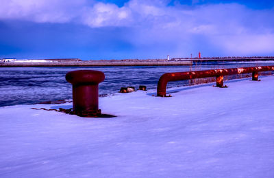 Scenic view of sea against sky during winter