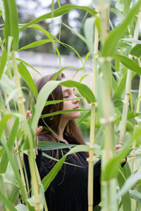 Portrait of woman with plants