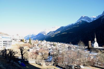 View of town against clear blue sky