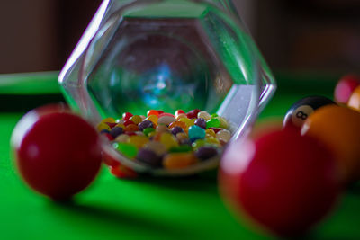 Close-up of multi colored balls on table