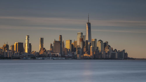 Modern buildings in city at sunset