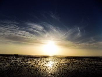 Scenic view of calm sea at sunset