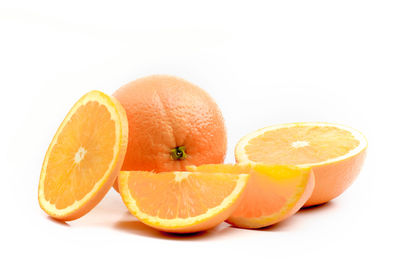 Close-up of orange fruit against white background