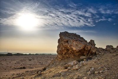 Rock formations on landscape against sky