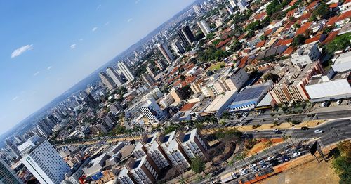 High angle view of road by buildings against sky