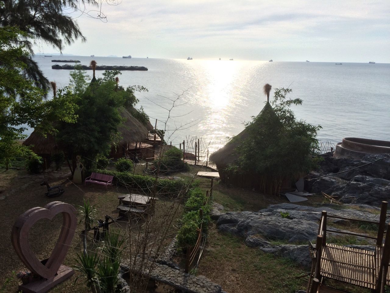 water, sea, horizon over water, sky, tranquil scene, tranquility, beach, tree, scenics, nature, beauty in nature, shore, sunlight, nautical vessel, transportation, mode of transport, sun, high angle view, idyllic, moored