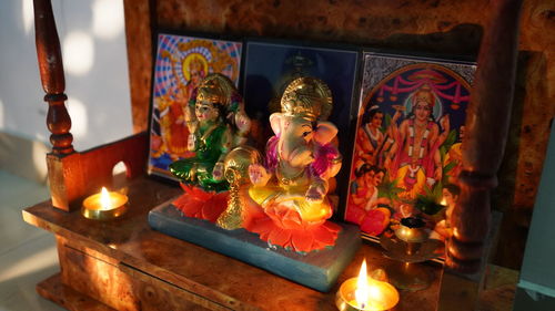 Lit candles in temple