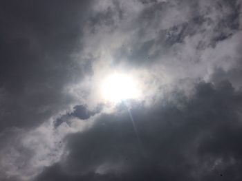 Low angle view of sun in sky