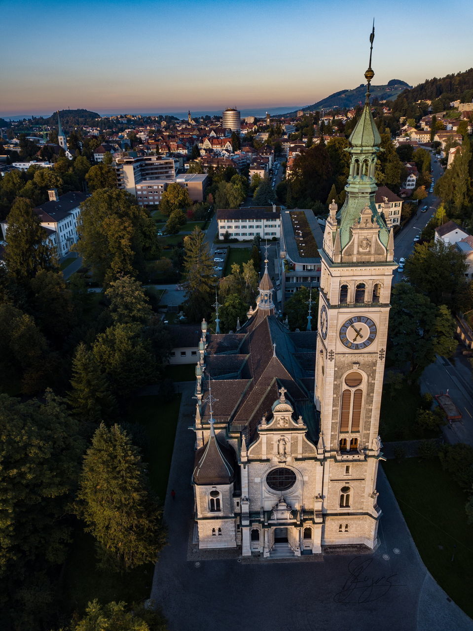 HIGH ANGLE VIEW OF BELL TOWER IN CITY