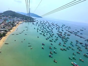 High angle view of crowd on beach against sky