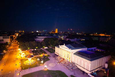 High angle view of illuminated buildings in city at night