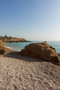 Scenic view of beach against clear sky