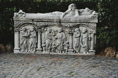 Statue against historic building