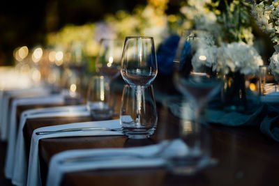 Luxury table settings for fine dining with and glassware, pouring wine to glass. 