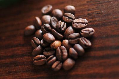 Close-up of coffee beans on table